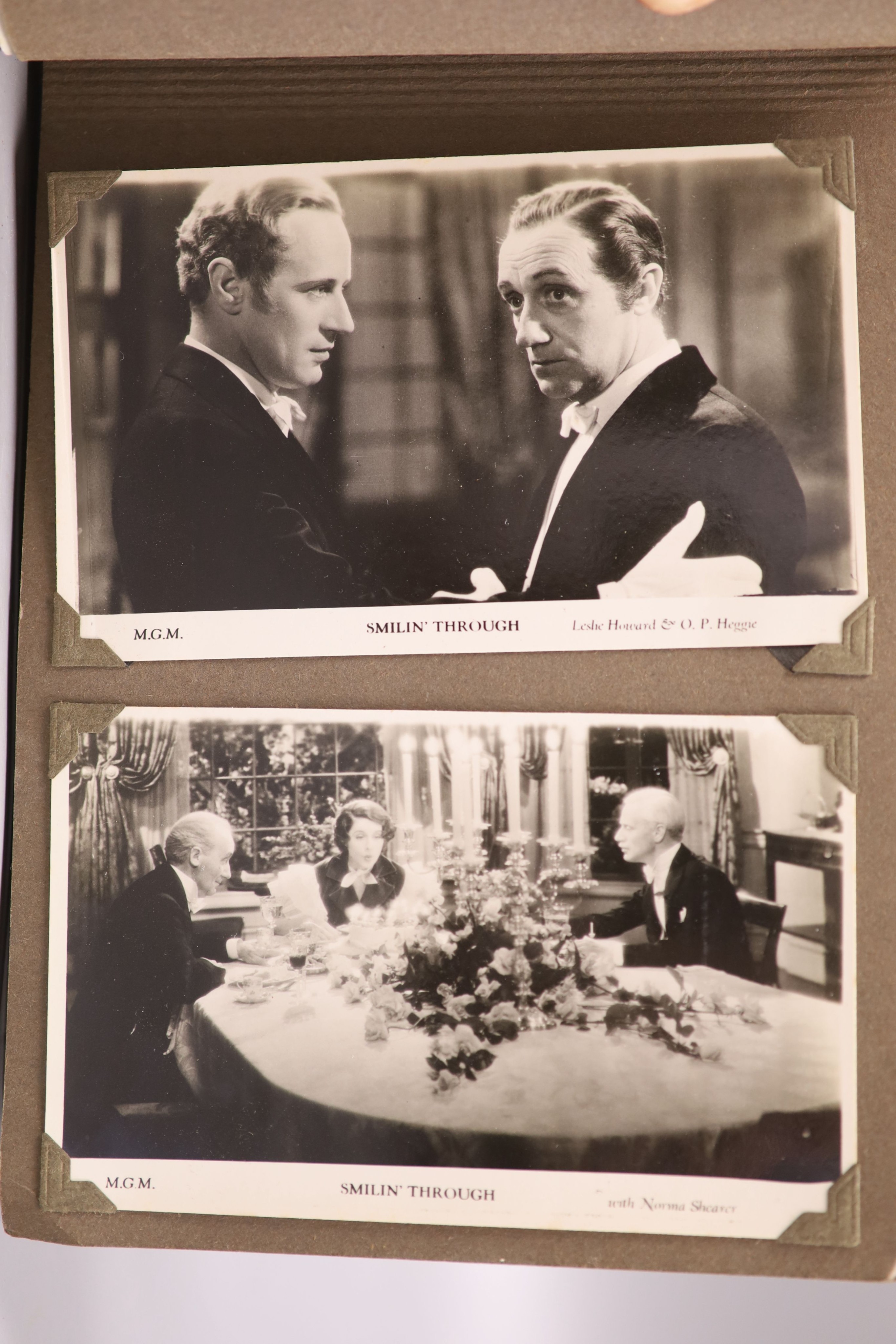 An album of 1930s monochrome postcards including film stars, some signed, letter and other signatures